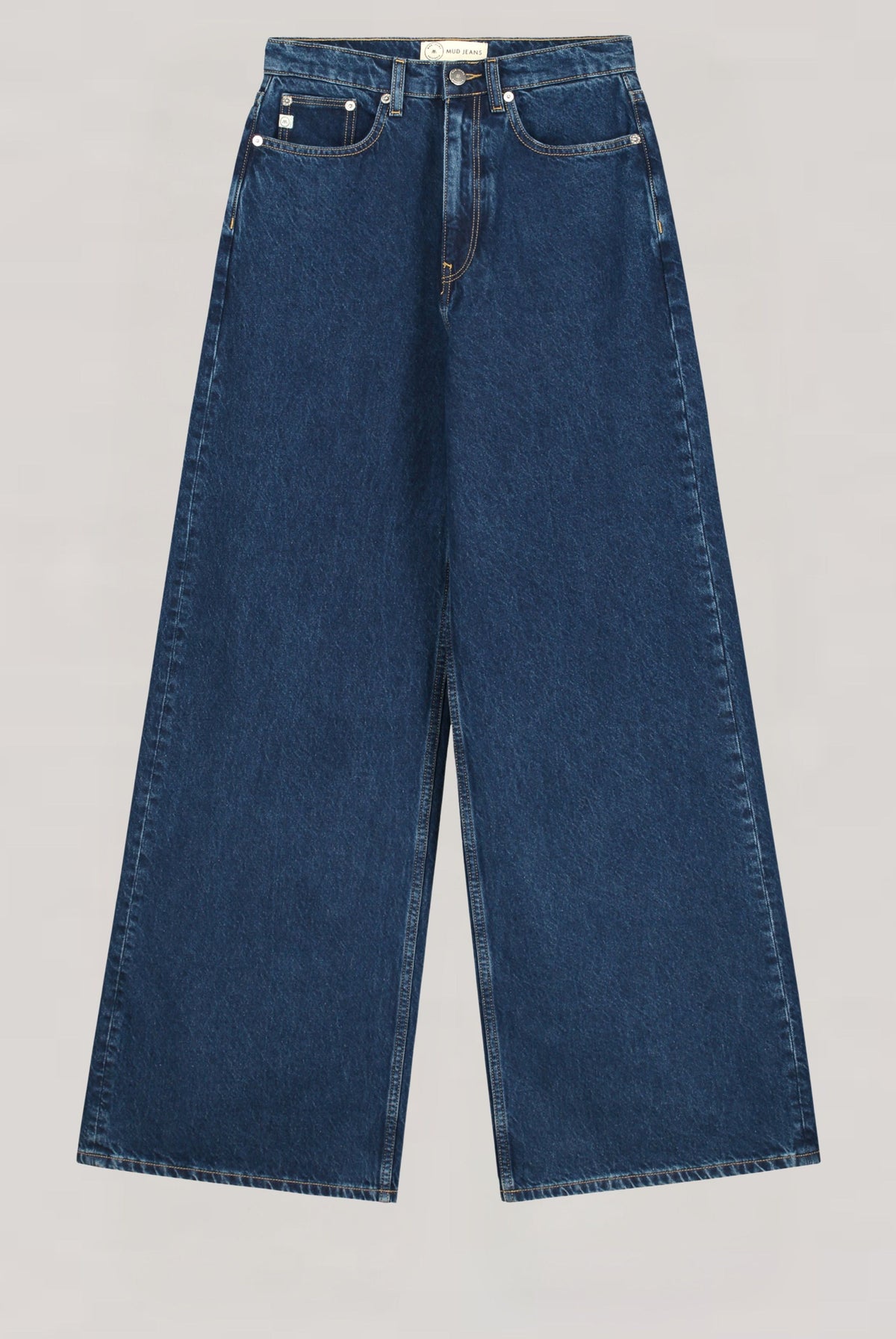 Wide-leg sustainable jeans in dark blue denim, showcasing eco-friendly MUD Jeans fabric with classic five-pocket design.