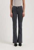 High-waisted black flared jeans worn with a fitted gray tank top, showcasing stylish casual women's fashion.