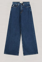 Wide-leg sustainable jeans in dark blue denim, showcasing eco-friendly MUD Jeans fabric with classic five-pocket design.