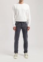 Sustainable MUD Jeans in dark denim, classic fit, showcasing ethical fashion with eco-friendly materials.
